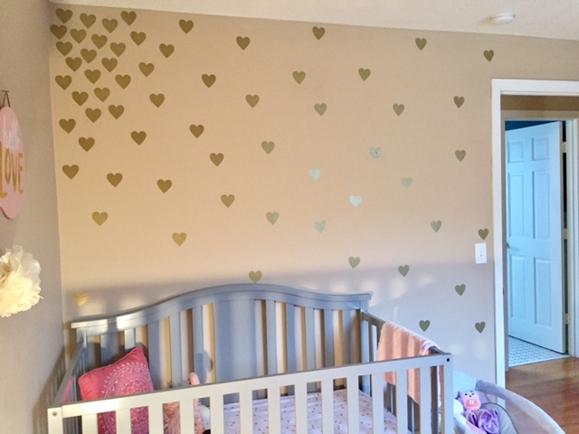 baby girl nursery with mint, coral and gold